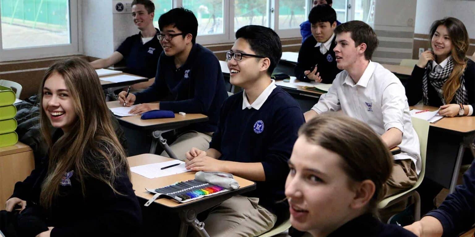 Diverse students engaging in a classroom activity at an international school, promoting academic excellence and cultural diversity.