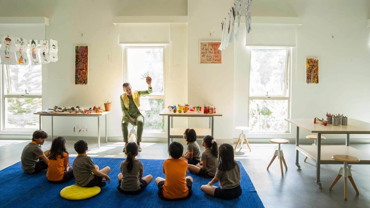 Colorful classroom with children attending art class at a reputed international school.