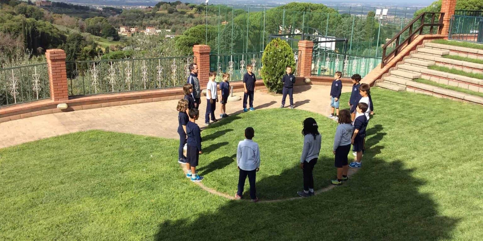 Students outdoor activity at world schools campus, engaging in team-building exercises.