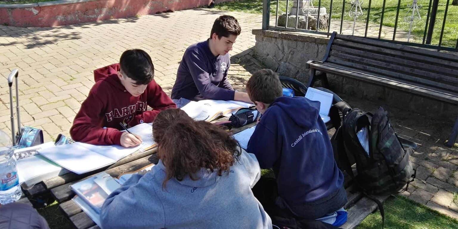 Students studying outdoors at World Schools, fostering international education and global learning experiences.