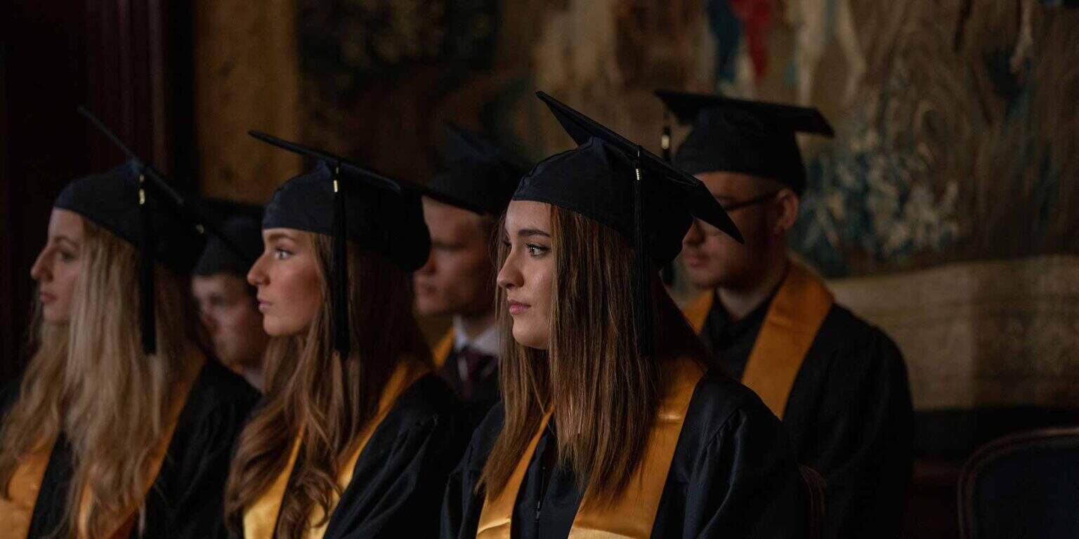 Graduates in caps and gowns during a formal graduation ceremony at World Schools.