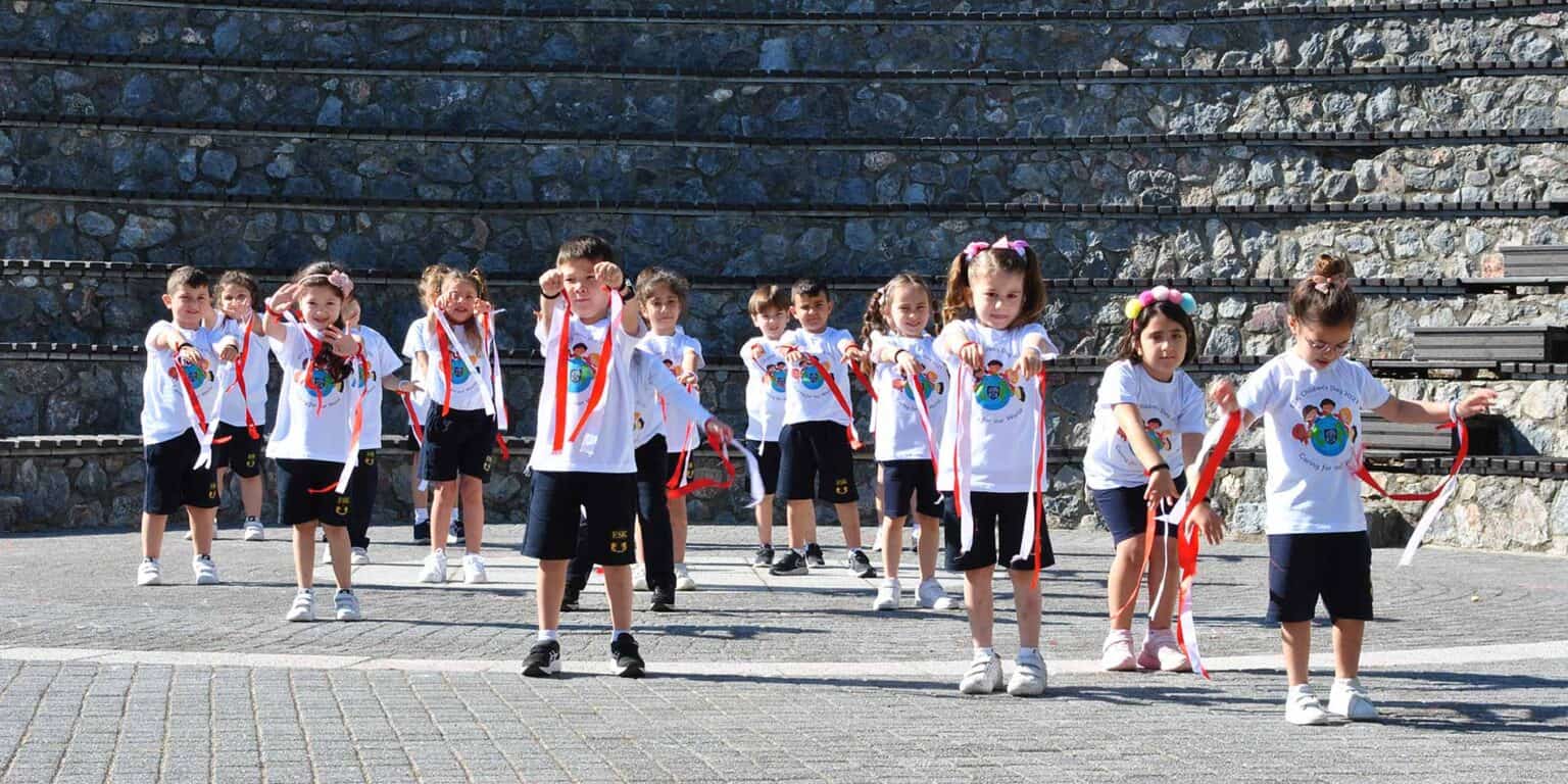 Children participating in outdoor school activity at World Schools, showcasing engaging learning environment.