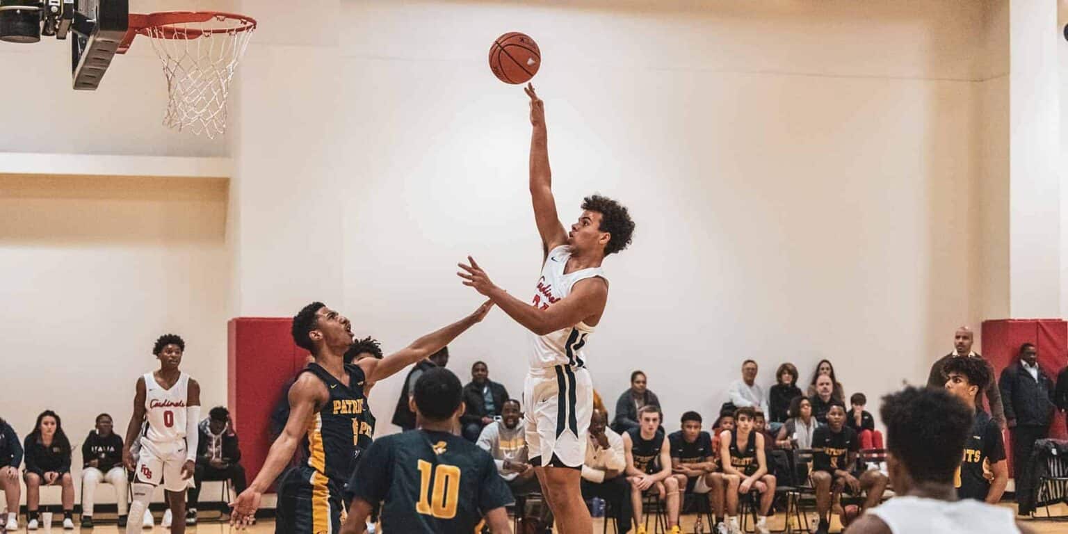 Dynamic basketball game scene at World Schools sports event, showcasing talented students competing and demonstrating athletic excellence.