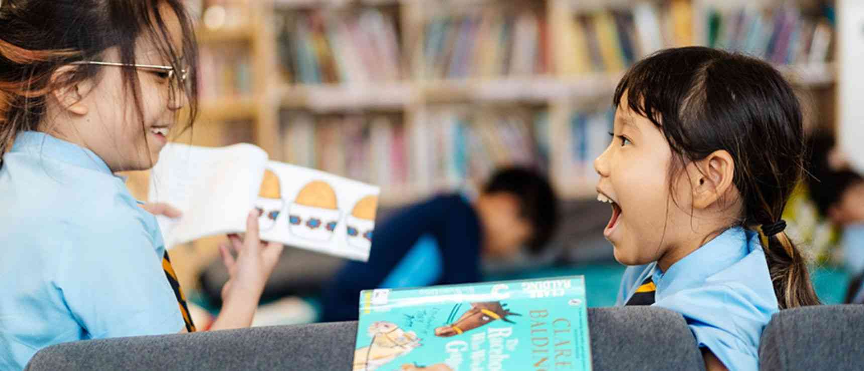 Bright-eyed children enjoying storytelling in school library, fostering a love for learning and reading excellence.