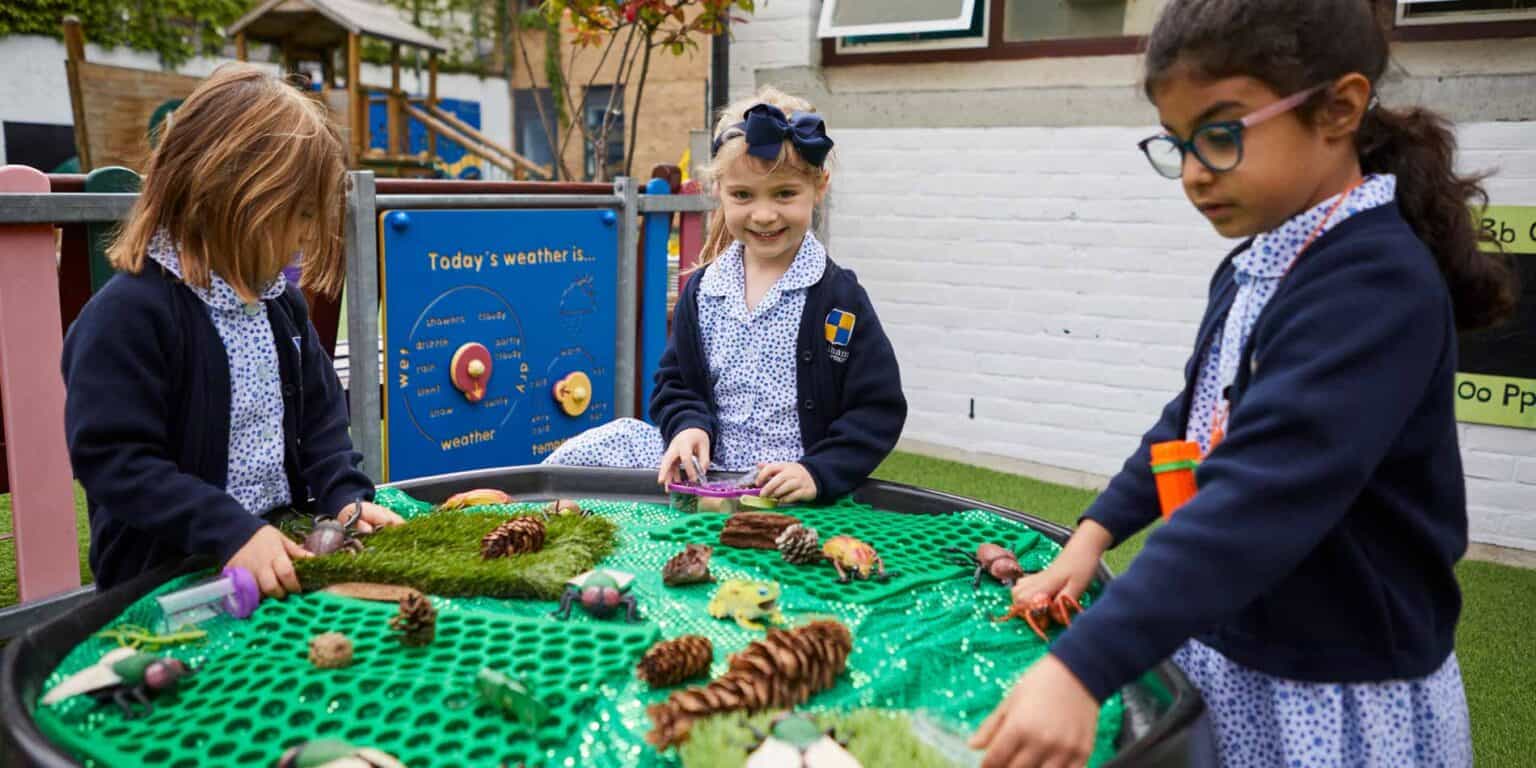 Colorful outdoor learning activity with children exploring nature at a world school.