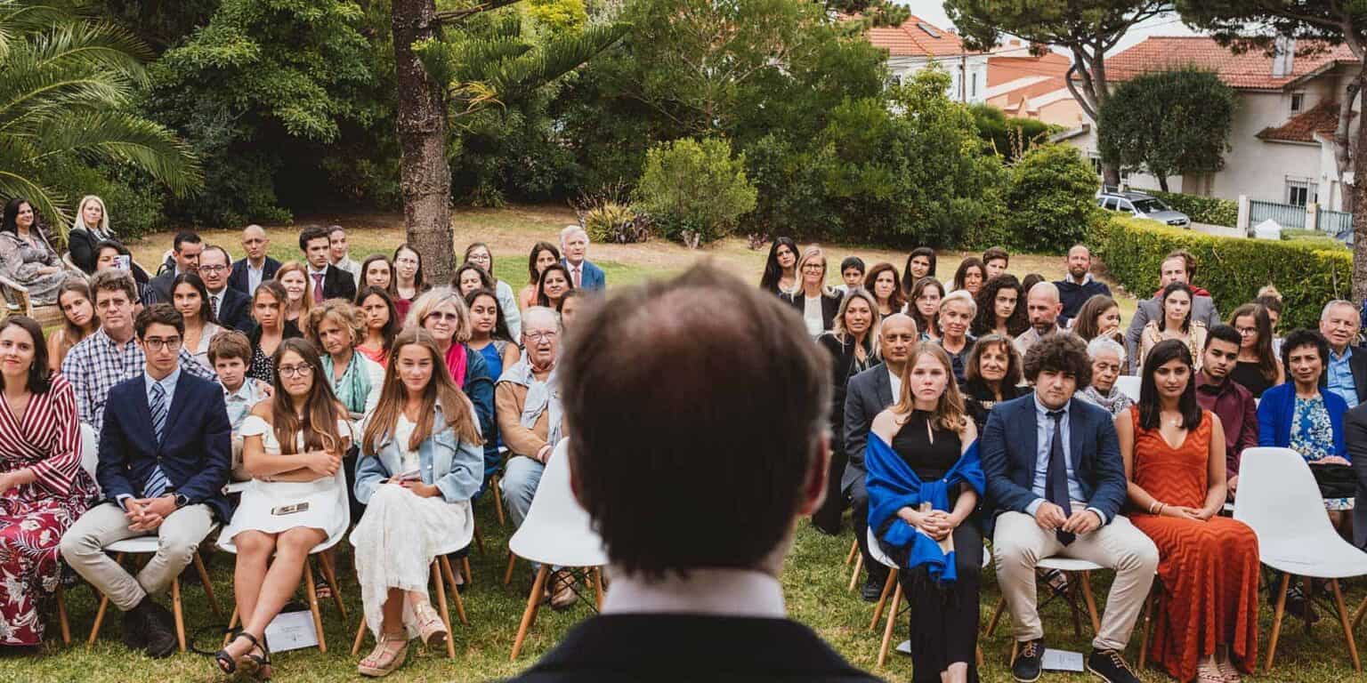 Diverse students and faculty attending outdoor school event at a prestigious World Schools campus.