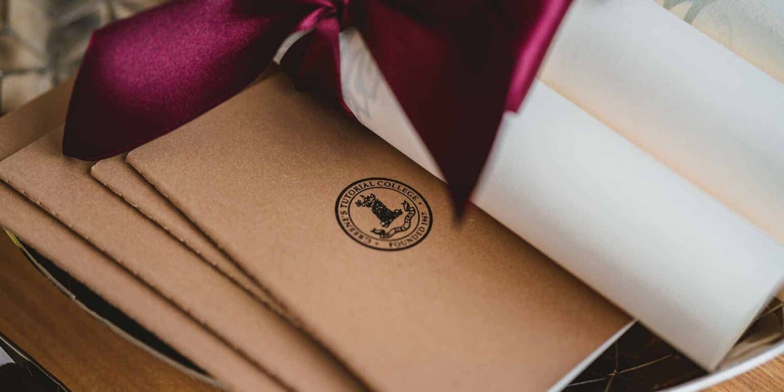 School supplies with a tutorial college logo for international student education.