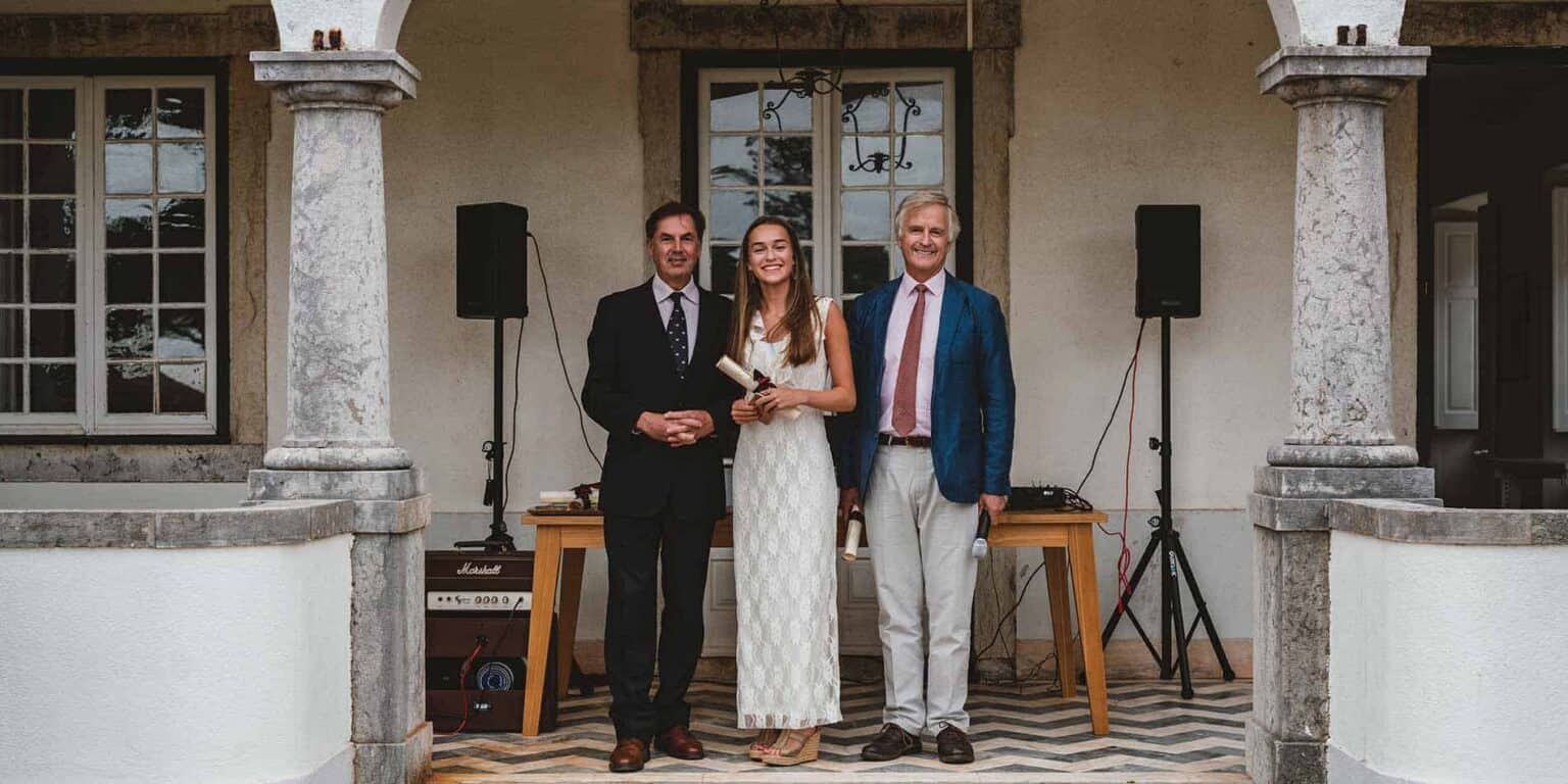 Elegant school award ceremony at a historic building hosting students and officials.
