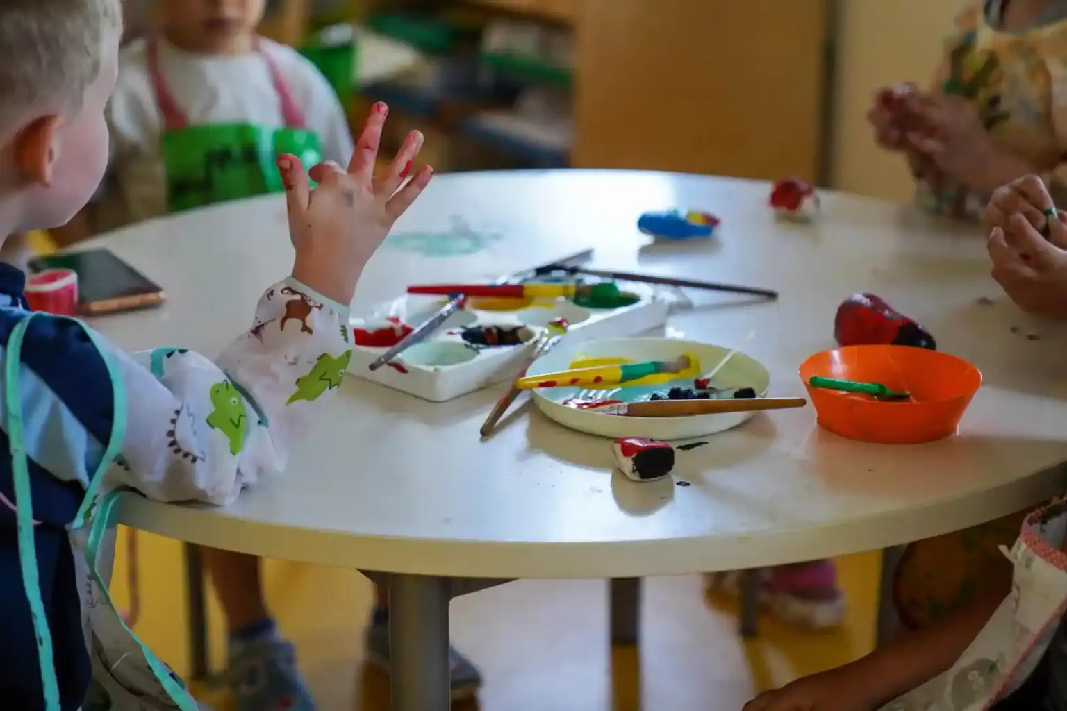 Colorful children's art activities at an international school classroom, fostering creativity and global learning.