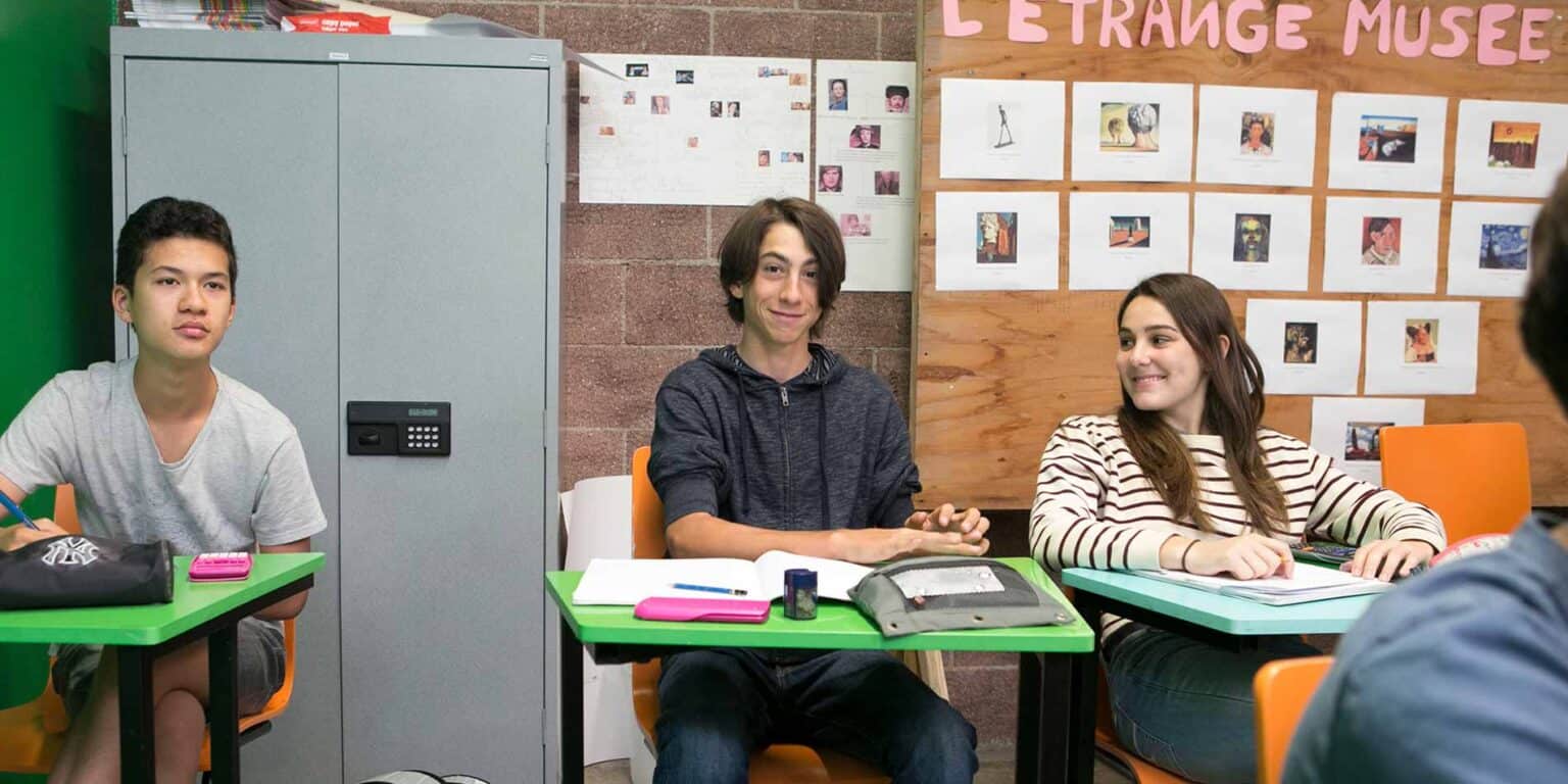 Bright school classroom with diverse students engaging in learning activities at World Schools.