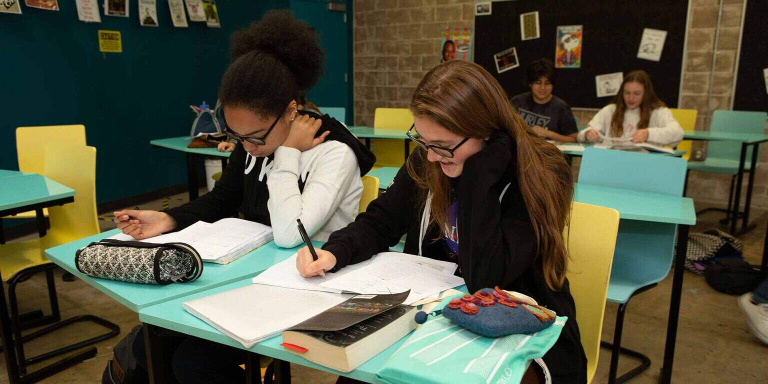 Engaged students studying in a modern classroom at a leading world school for optimal learning.