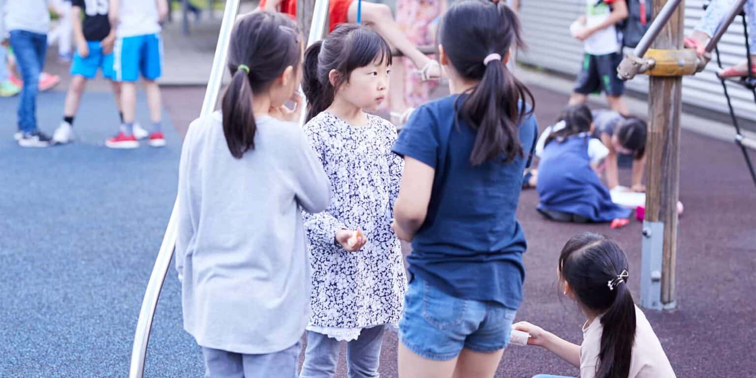 Children playing and socializing at a world schools outdoor playground.