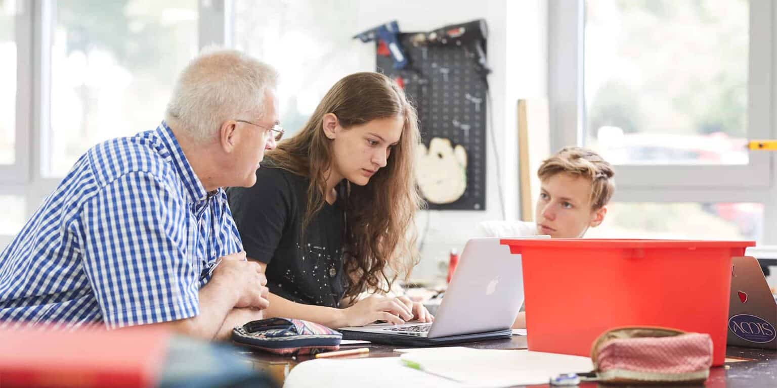 Innovative classroom at a prestigious World Schools with students engaging in technology-based learning.