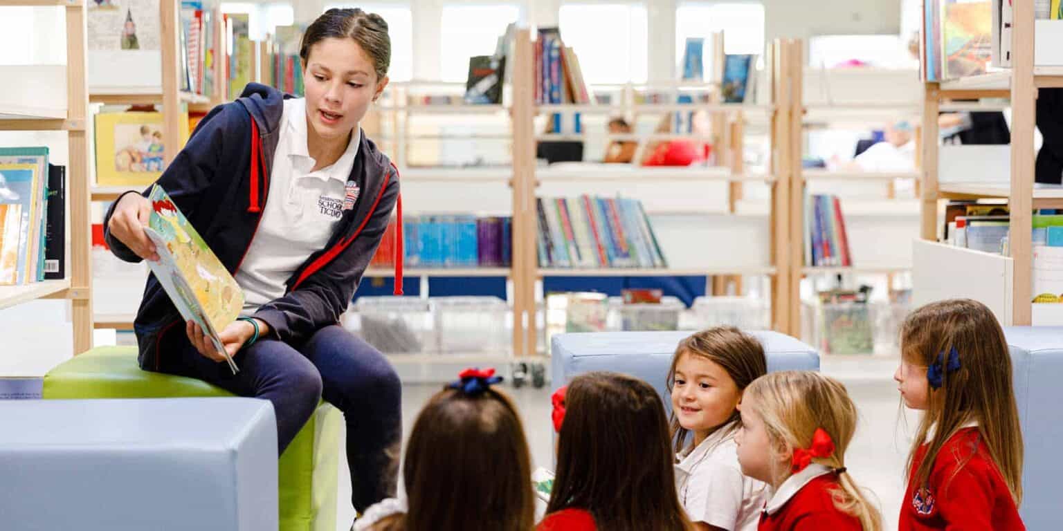 Engaging children in a classroom reading activity at a modern library for optimal learning.