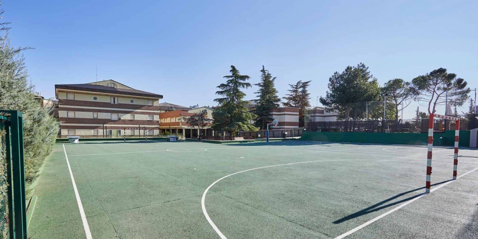 Bright outdoor multi-purpose sports court at a World Schools campus for students' physical activities and recreation.