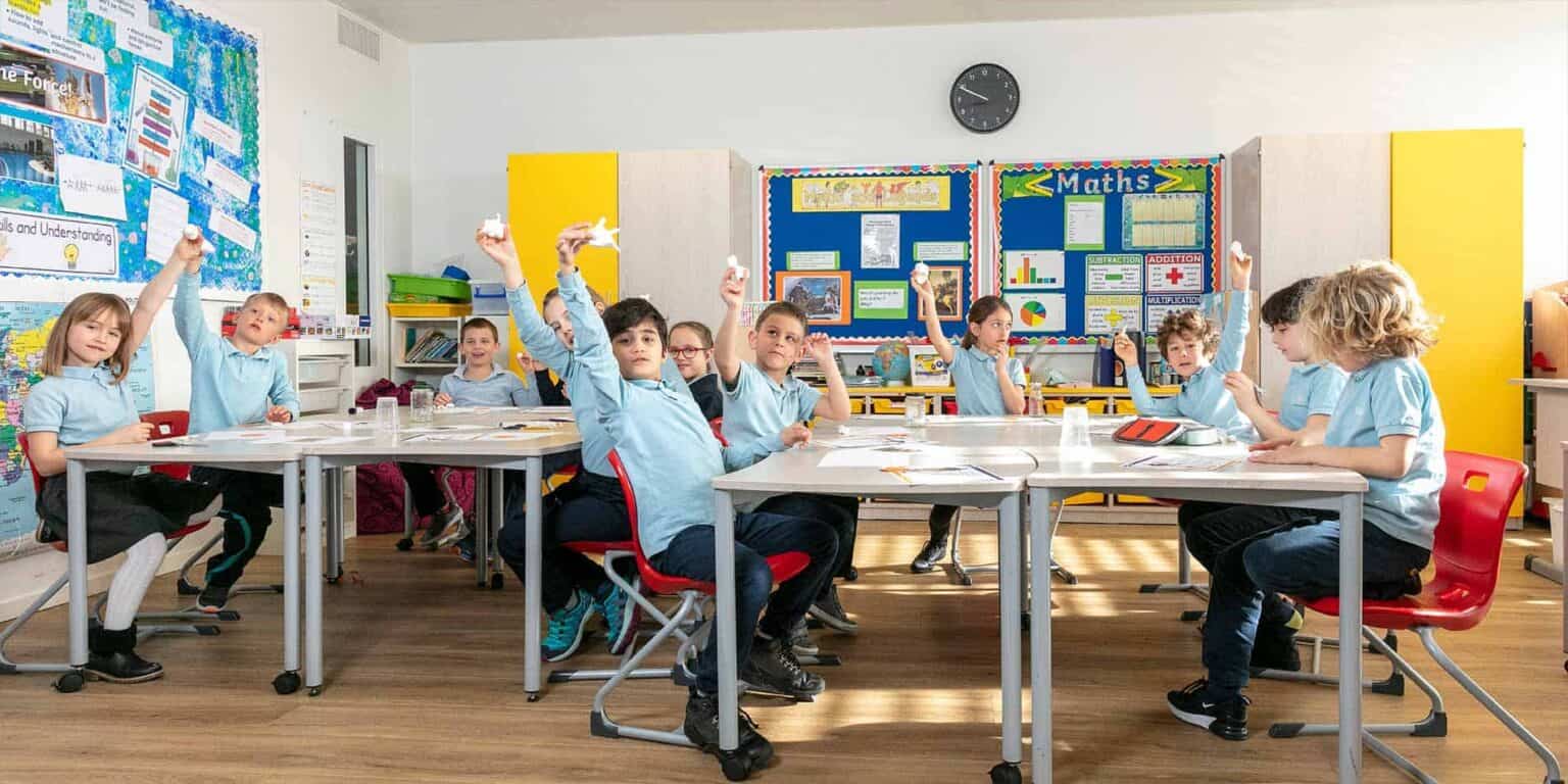Students in a colorful classroom during a school activity at World Schools.