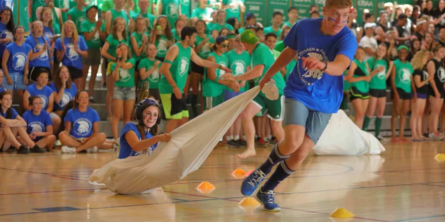Students participating in school sports event at World Schools, promoting teamwork and fitness.