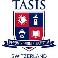 Modern school building with students outdoors at Tasis Switzerland campus.