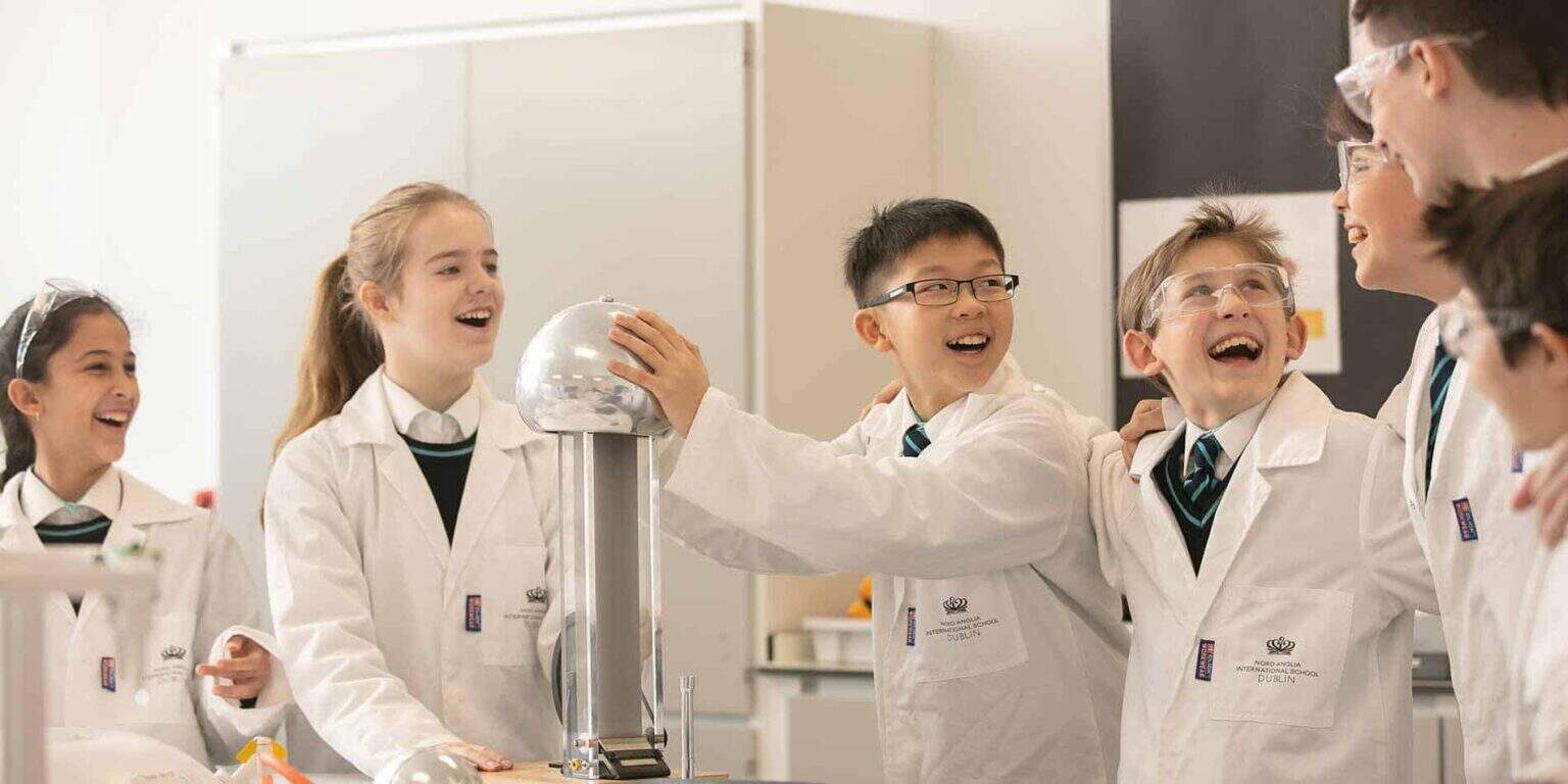 Chemistry science class with happy students; international school in Dublin, Ireland.