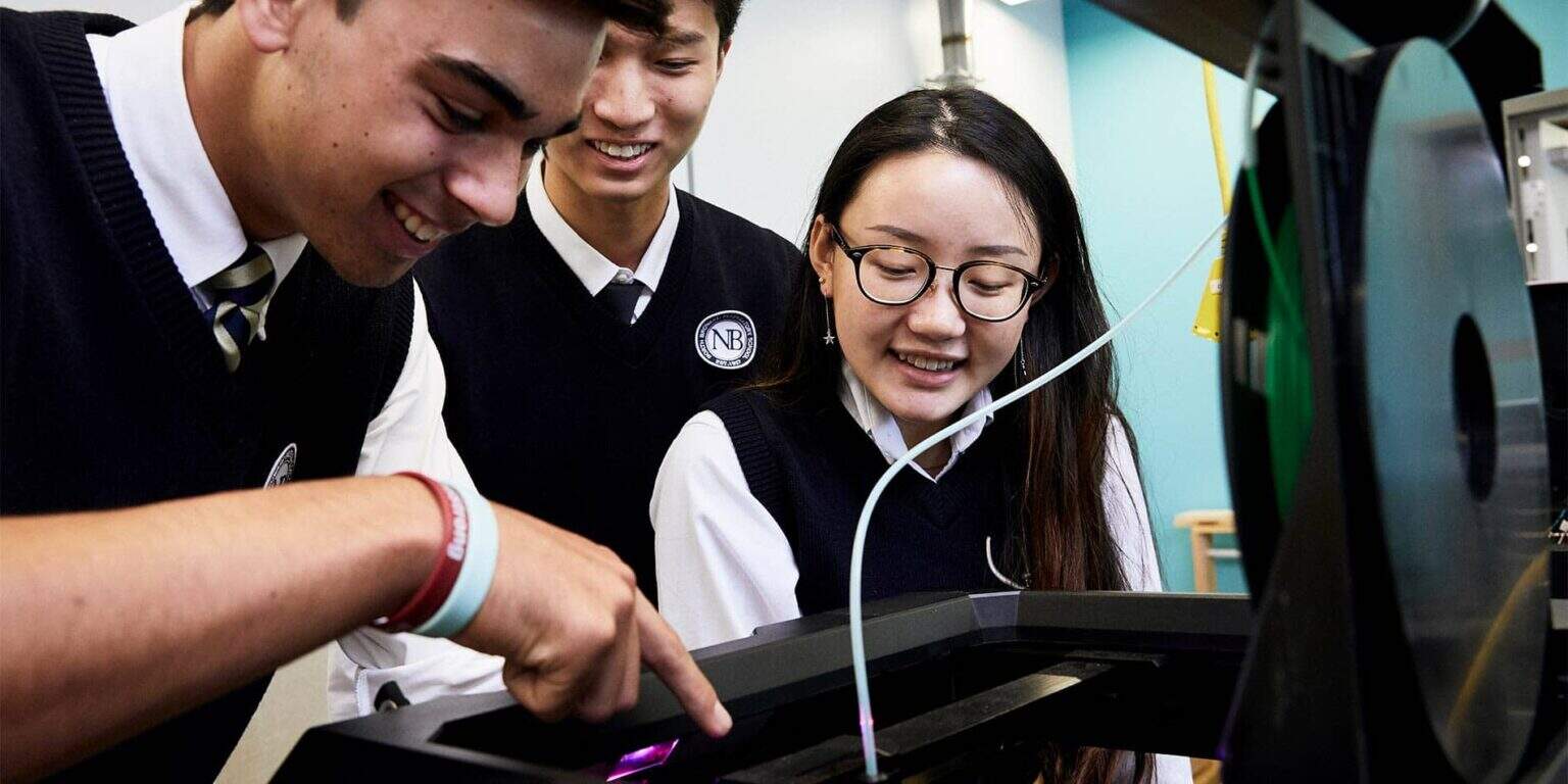 Innovative students collaborating on STEM project at World Schools, fostering 21st-century skills.