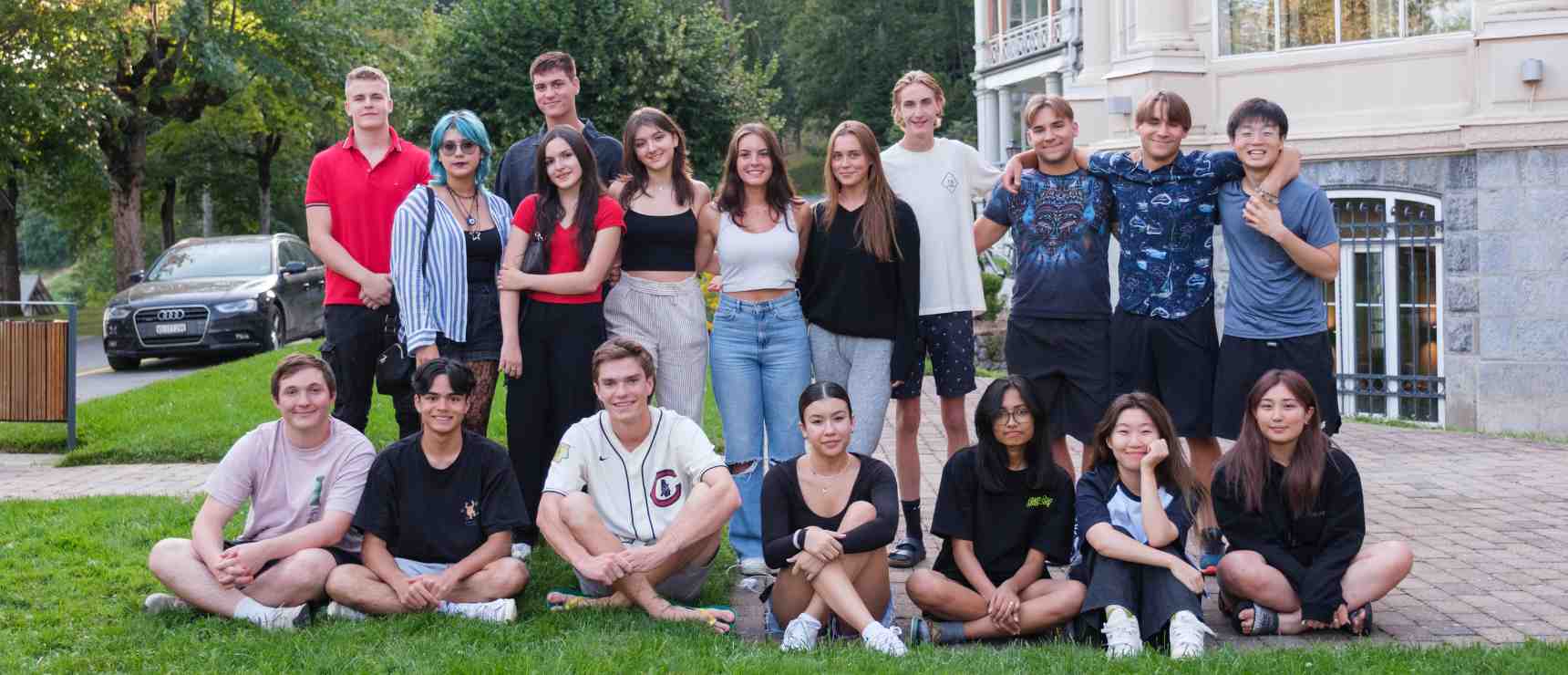 Diverse group of students outdoors at a premium international school, promoting global education and multicultural learning.