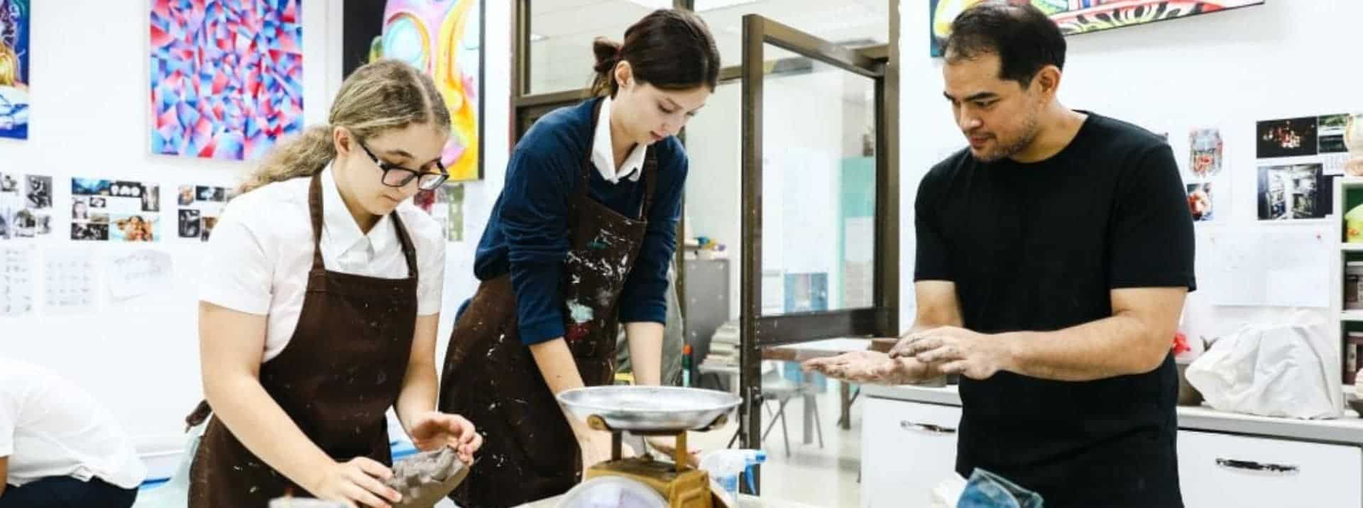 Innovative art students working together in a creative classroom environment.