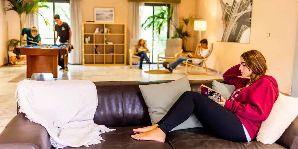 Modern student lounge interior at a world schools campus promoting academic excellence and student well-being.