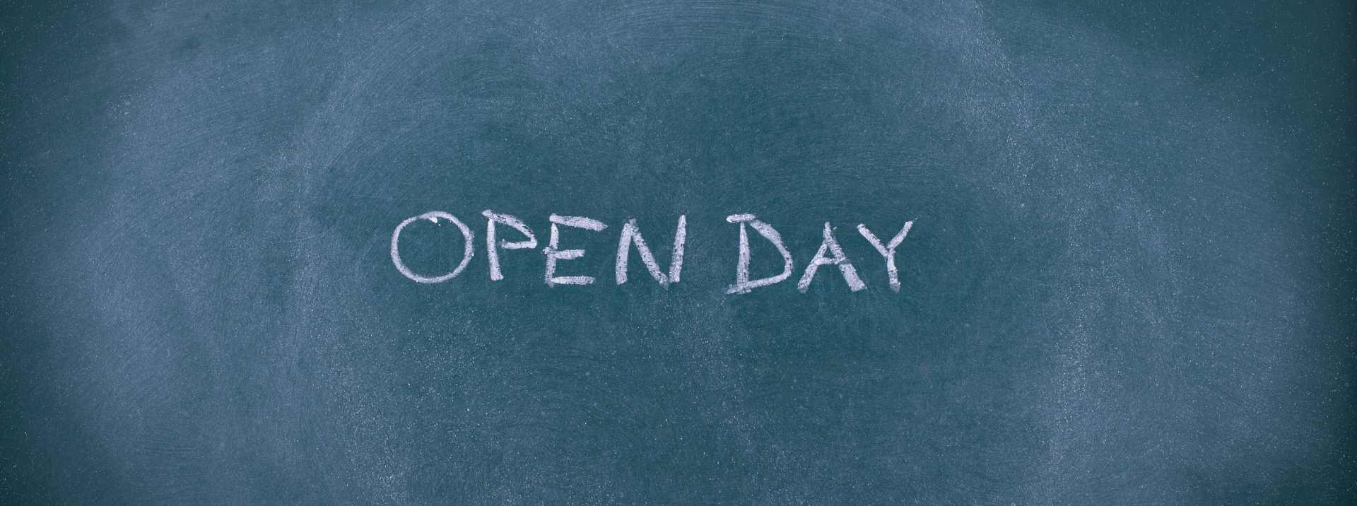 Open day announcement on chalkboard for international school enrollment.