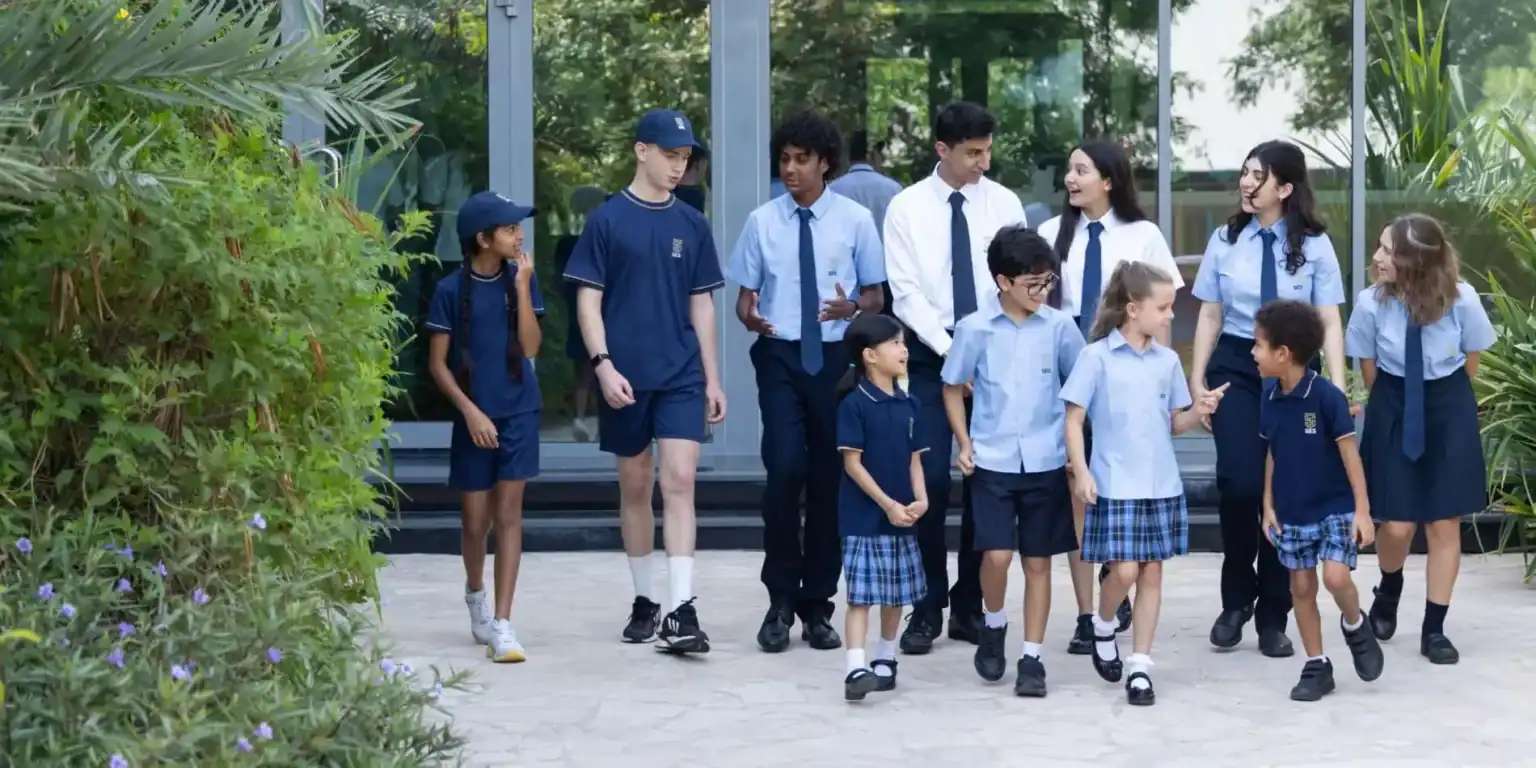 Diverse group of students and teachers walking outdoors at World Schools, emphasizing inclusive global education.