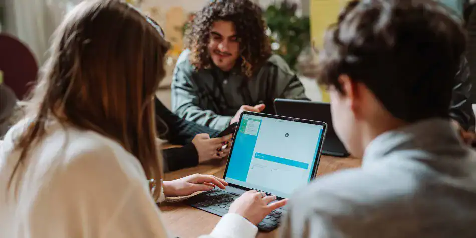 Interactive learning session with diverse students using digital devices at a world school campus.