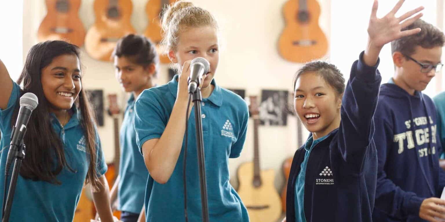 Bright school students participating in class activity at an international school.