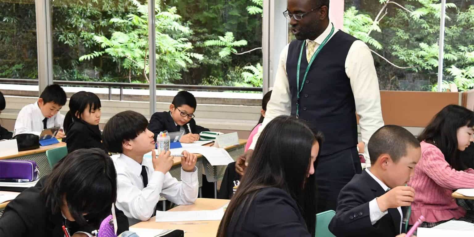 Students engaging in classroom learning at an international school, diverse students in a modern learning environment.