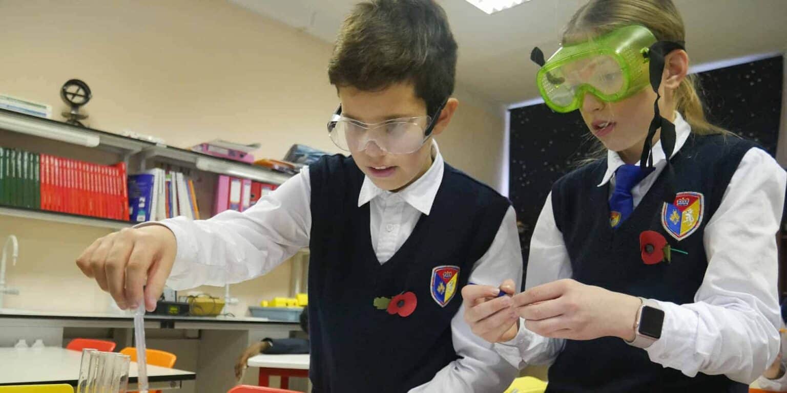Innovative school science lab with students conducting experiments, promoting STEM education excellence.
