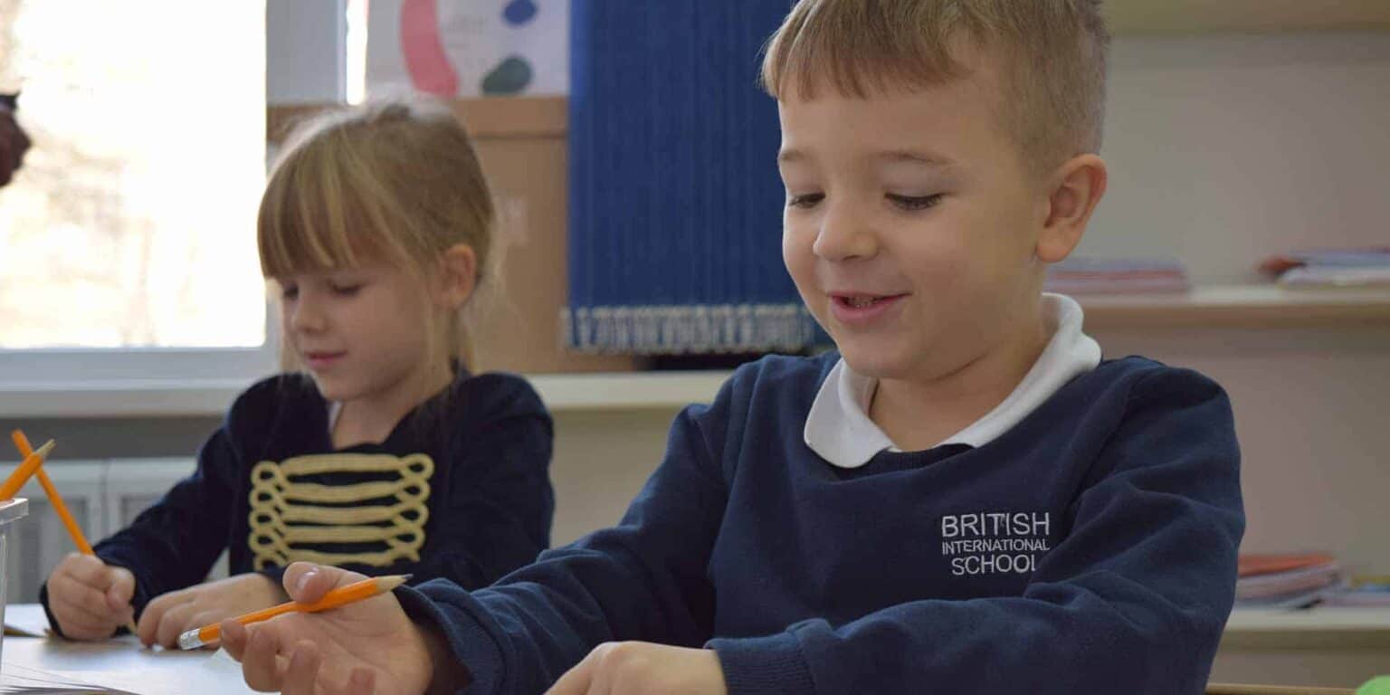 Child students engaged in classroom activities at British International School, fostering global education and academic excellence.