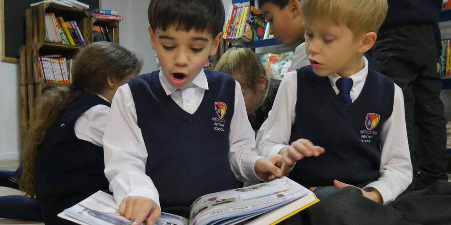 Students reading textbooks at World Schools, enhancing academic excellence and international education experiences.