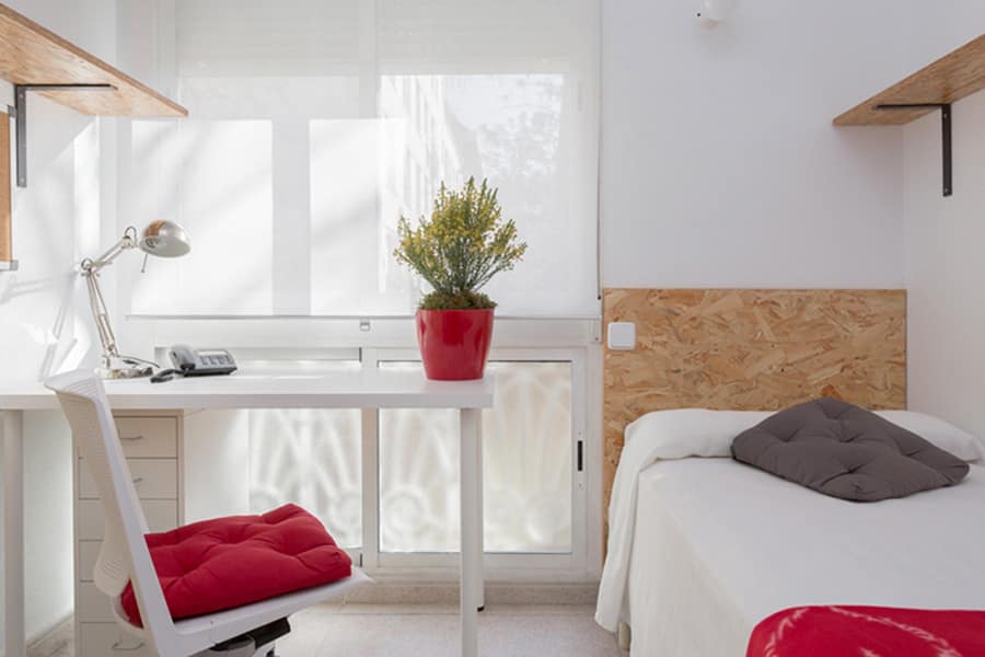 Bright modern student bedroom with workspace and natural light, ideal for international students at World Schools.