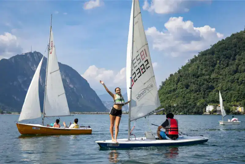 This Month at TASIS: June 2024 24 Active students sailing on a scenic lake at World Schools global program.