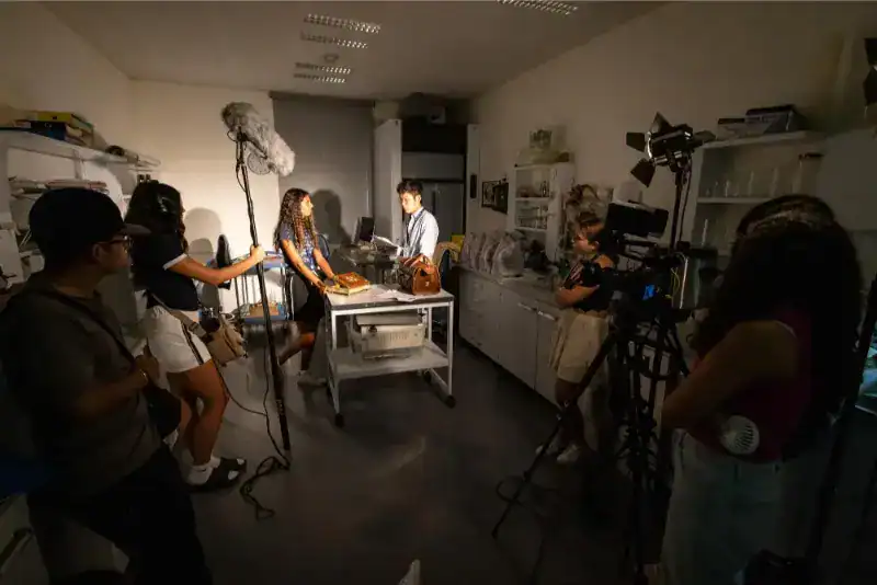 This Month at TASIS: June 2024 35 Creative students producing a video or documentary in a school classroom, capturing the essence of world schools.