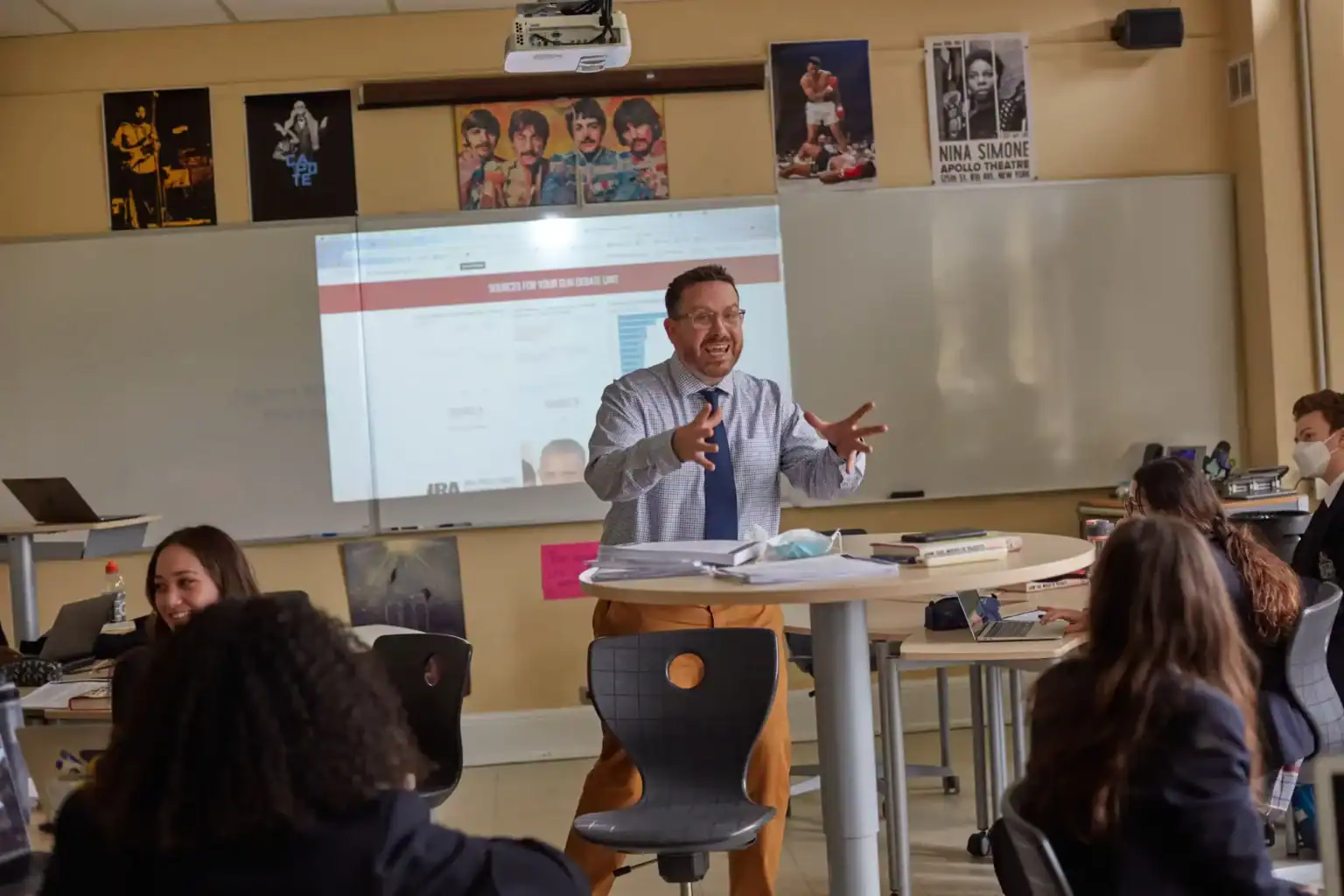 Engaging teacher lecturing students in a modern classroom at World Schools.