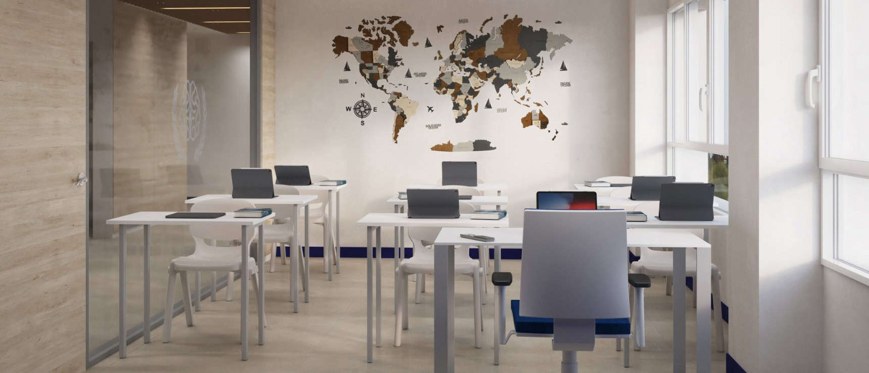 Modern classroom at World Schools with global map wall, desks, and laptops for international education.