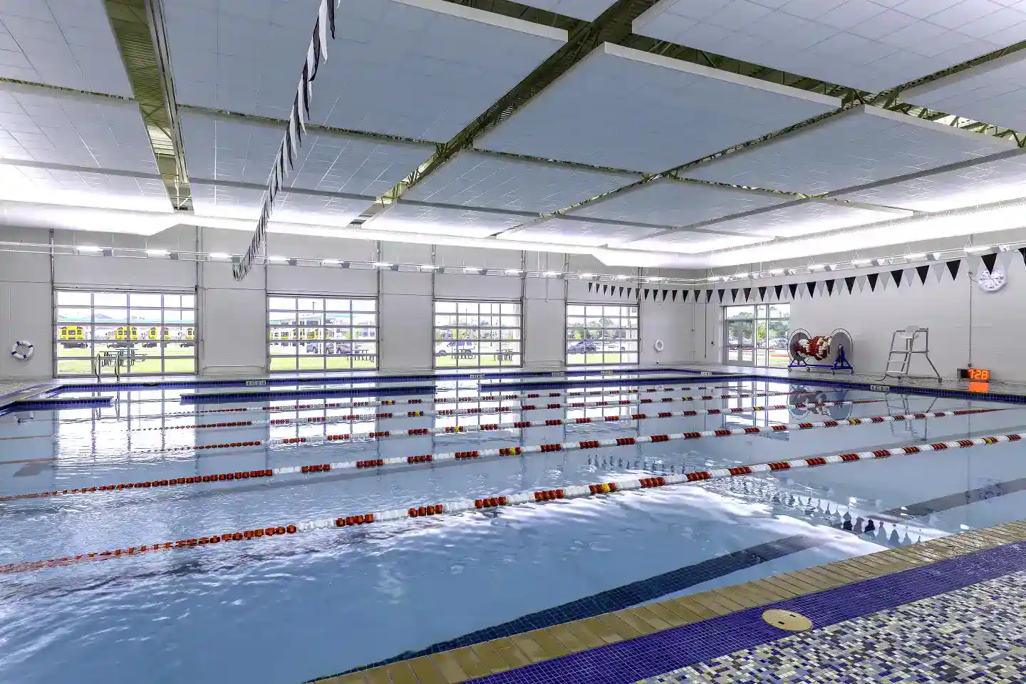 Modern indoor swimming pool at World Schools for student athletic programs and aquatic education.