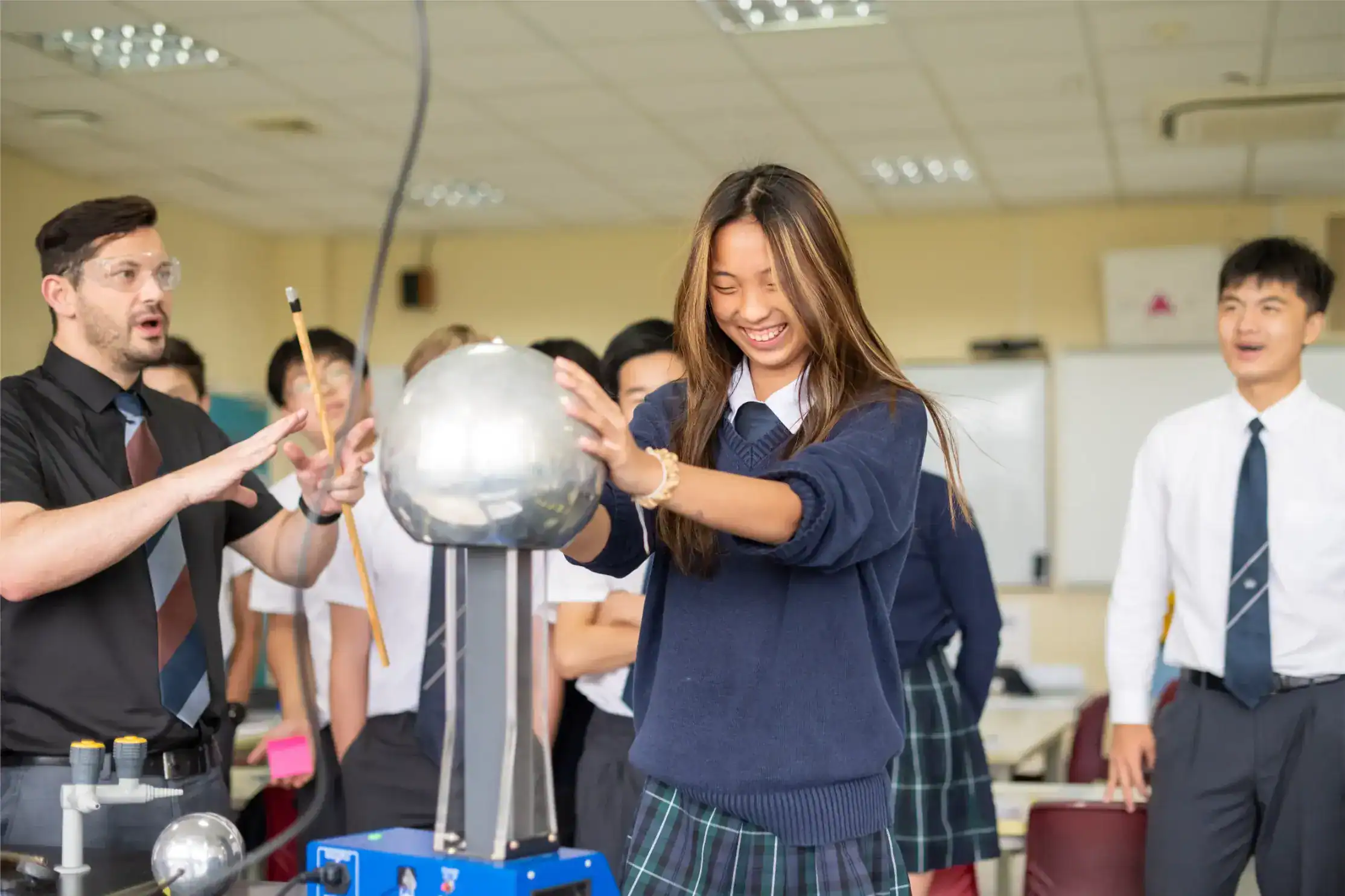 Engaging classroom with students experimenting with science, highlighting innovative education at World Schools.