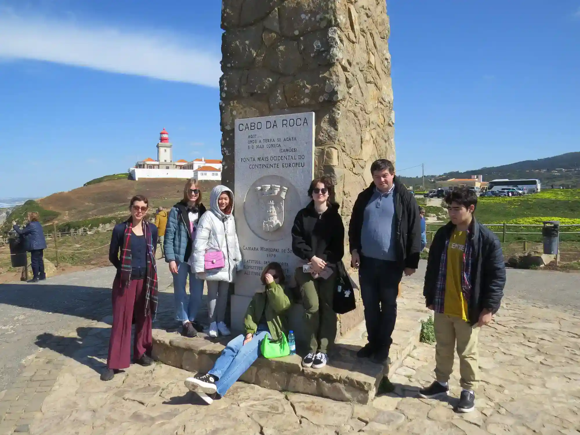 Students at Cabo da Roca, Europe's westernmost point, during an educational field trip showcasing scenic coastal views and historic landmarks.