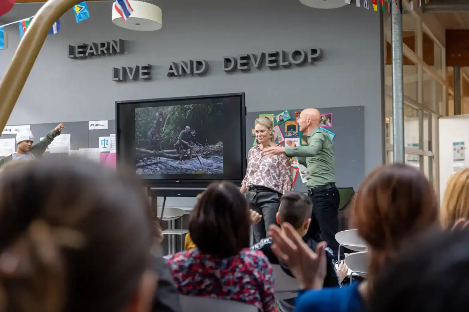 Innovative international school classroom with students, teacher, and digital learning environment at World Schools.