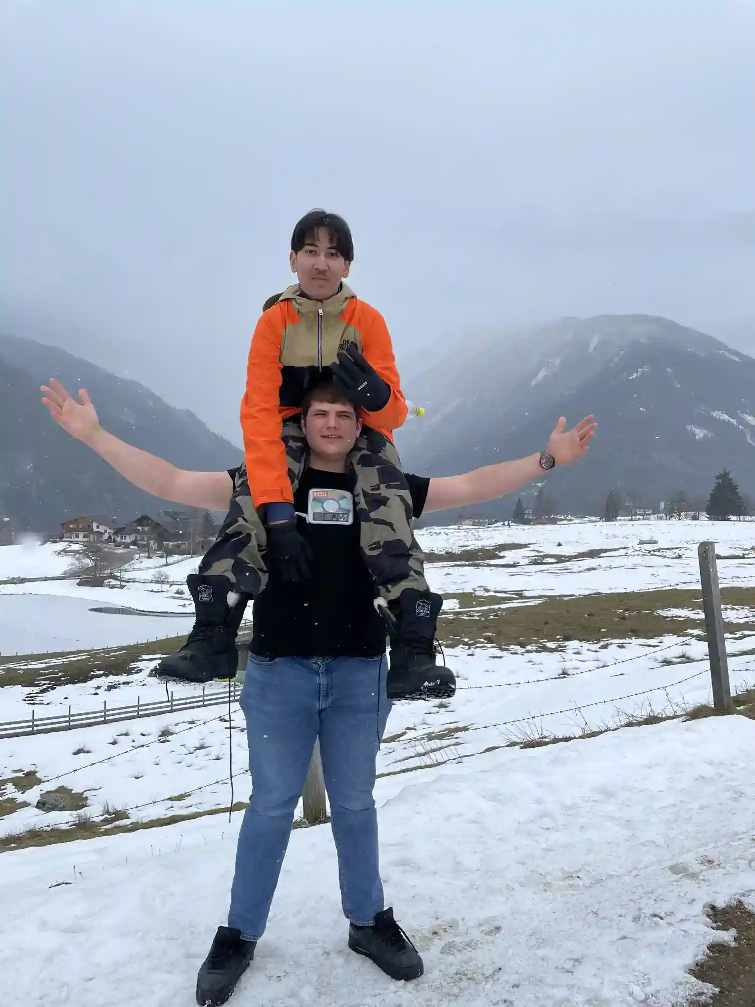 Children enjoying winter outdoor activities in snow-covered mountains, emphasizing adventure and exploration in outdoor education.