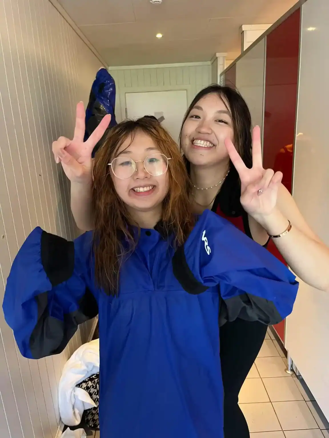 Happy students celebrating graduation at World Schools with vibrant campus environment.