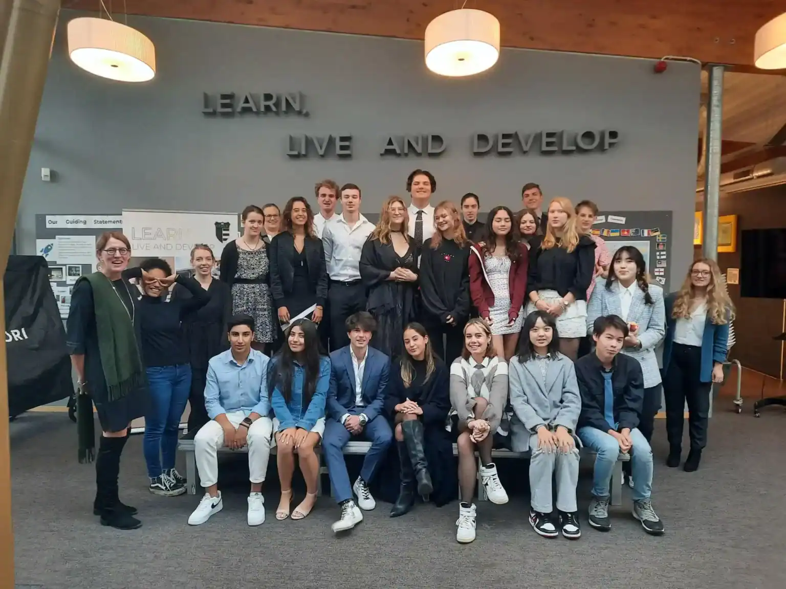 Students and teachers at a world school celebrating diversity and global learning.