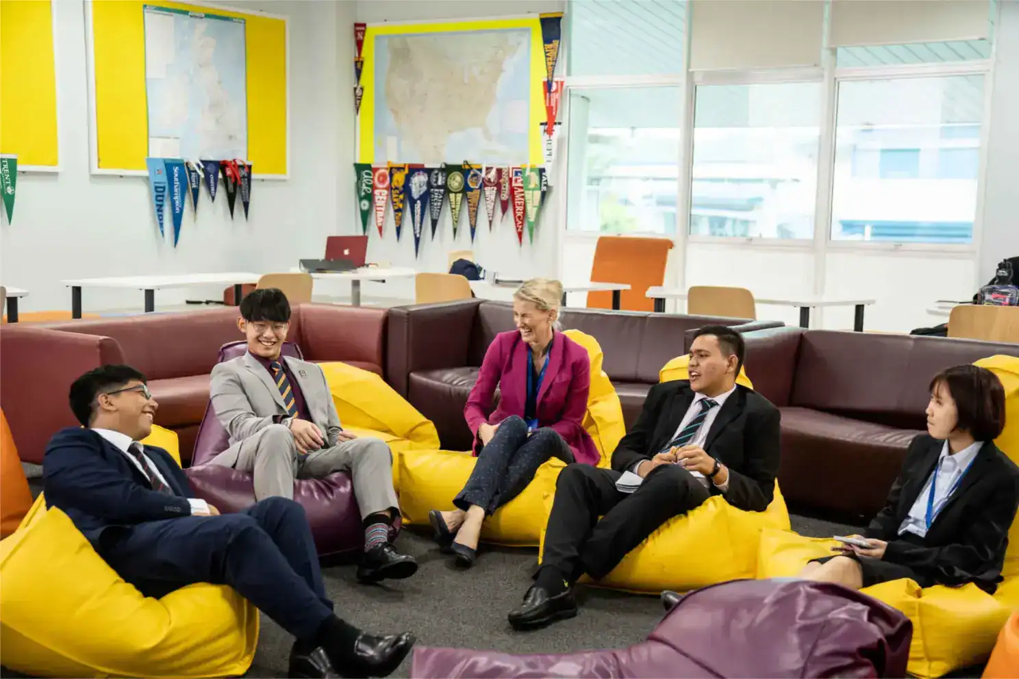 Young diverse students and teacher engaging in collaborative learning at an international school.