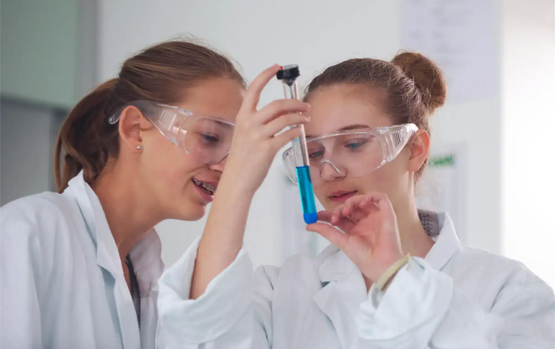 Innovative students conducting science experiments in a modern laboratory for world-class education.