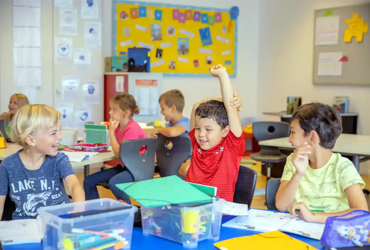 Bright young students engaging in classroom activities at World Schools, fostering global education excellence.